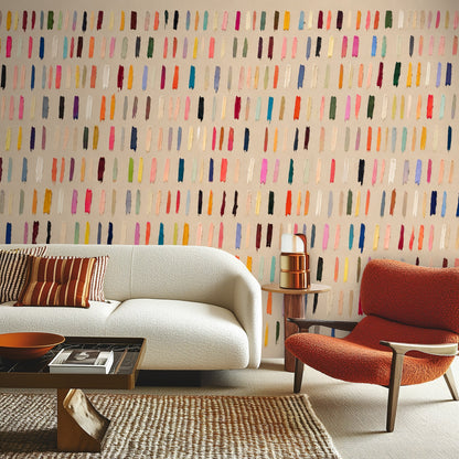 Living room vignette with deep blue velvet sofa in front of the multicolor brushstroke wall