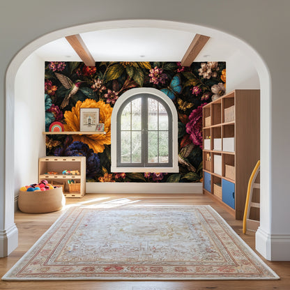 Golden retriever in a pet bed posed against the mural-scale floral wallpaper, showing how pattern reads at low eye level