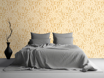 Boho bedroom with Auric Wander wallpaper behind a low wooden bed, woven pendant and natural textiles