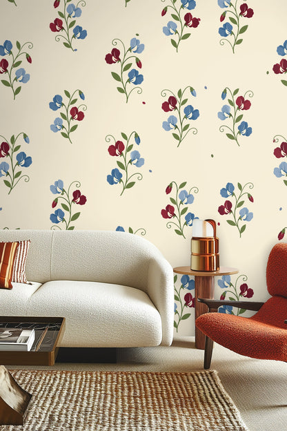Close-up of Sweetpea Reverie wallpaper illustrating subtle floral pattern with curling green leaves.