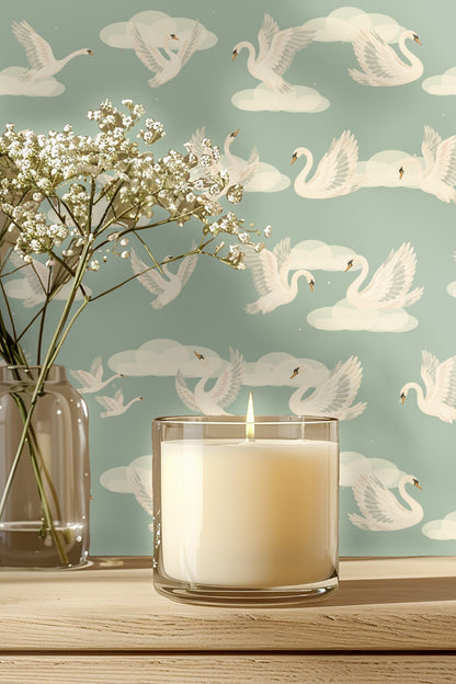 Bedroom scene with green bedframe against wall covered in Celestial Swans Wallpaper