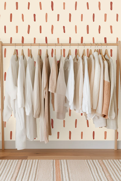 Pattern detail showing the hand-painted style vertical strokes in warm terracotta shades.