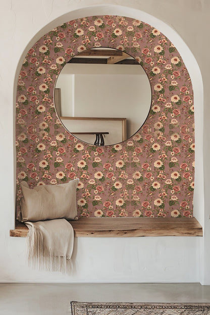 Detailed floral wallpaper pattern on dusty mauve background with beige and dusty rose blooms and olive leaves.