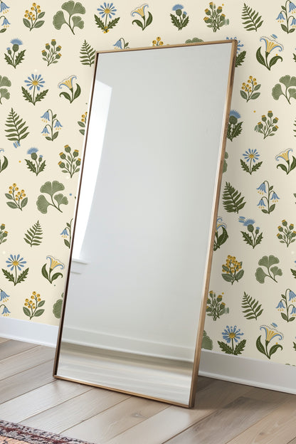 Close-up of illustrated thistle flowers and fern leaves in muted greens and soft blues