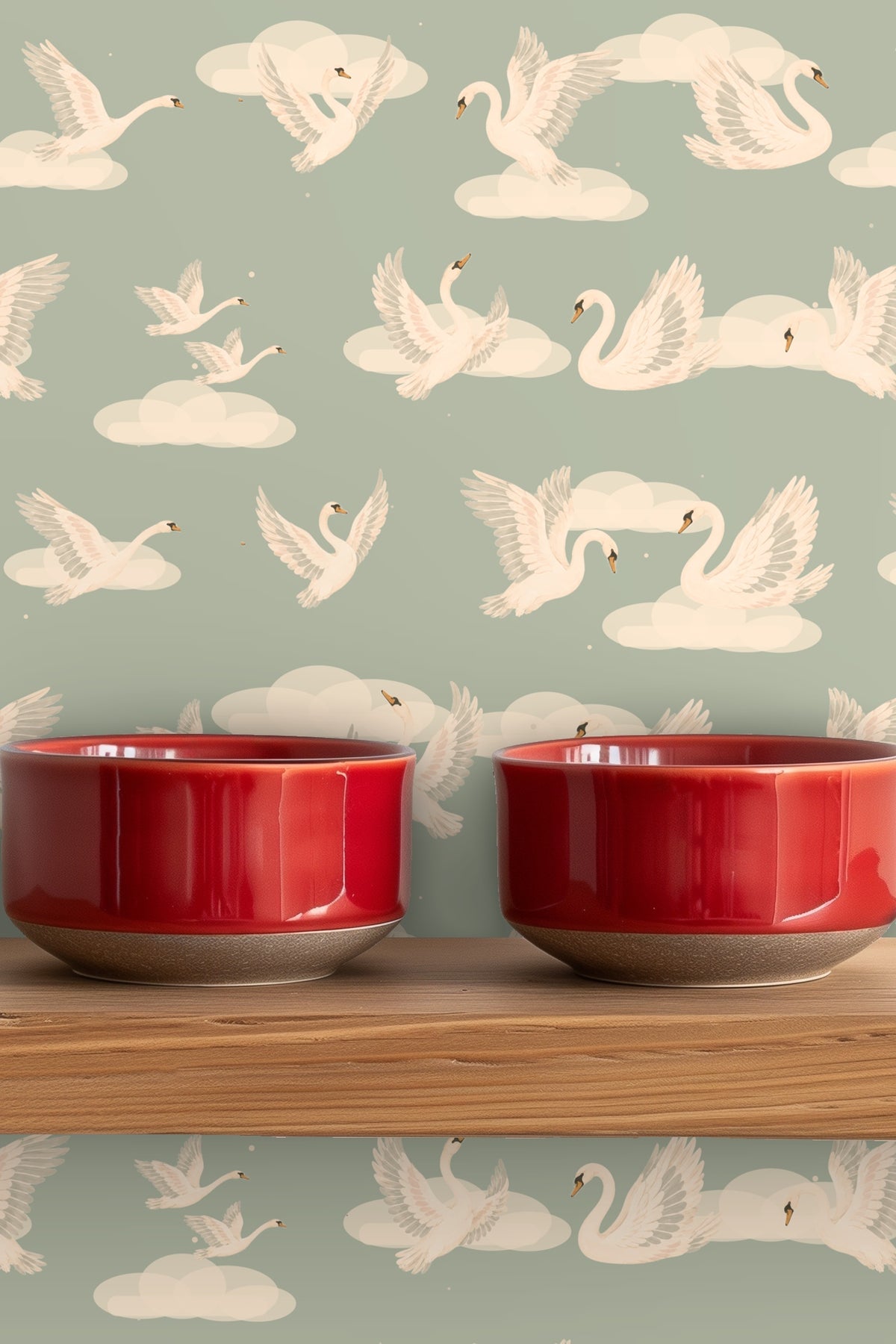 Ceramic vase holding white flowers on wood surface in front of wallpaper