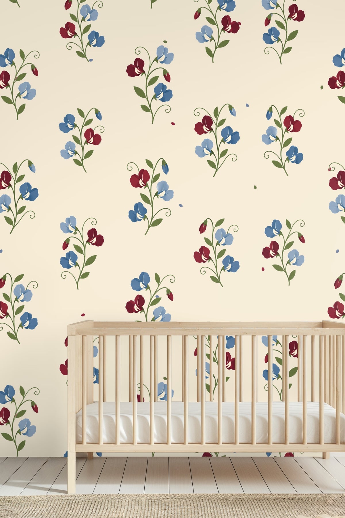Detailed view of Sweetpea Reverie wallpaper showing small blue and red floral bouquets on cream.