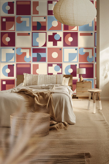Abstract geometric wallpaper with burgundy, dusty rose, cream, blue, and navy squares forming unique modernist compositions.