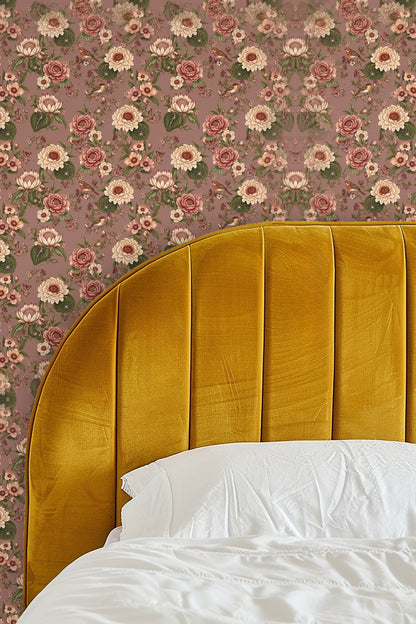 Living room wall with Autumn Reverie floral wallpaper behind a neutral beige sofa and a wooden coffee table on a woven rug.