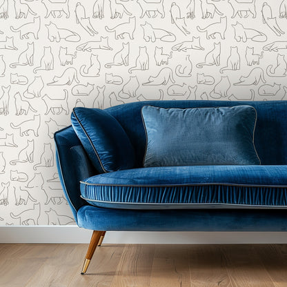 Neutral living room vignette with a beige sofa set against the Contour Catwalk wallpaper allover repeat