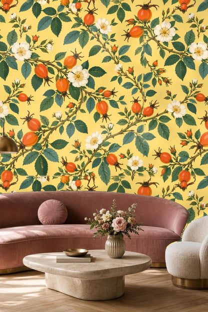 Orange rosehips with green leaves and cream flowers on wallpaper