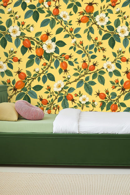 Room featuring wallpaper with rosehip branches and leaves in soft pale yellow setting