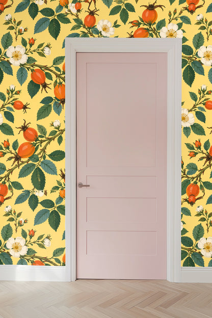 Green leaves and orange rosehips intertwined on wallpaper