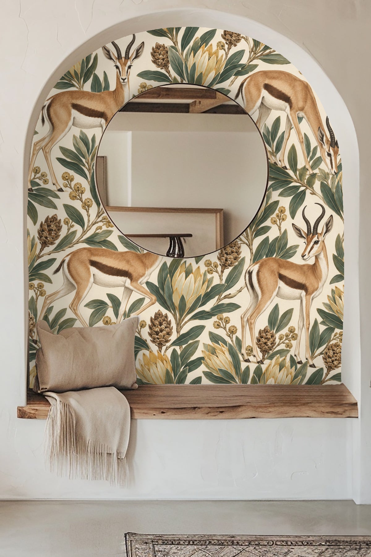Wallpaper pattern with springbok antelope and protea flowers in green and gold on cream background.