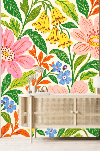 Wide shot of a bedroom with an accent wall fully wrapped in flower and leaf wallpaper.