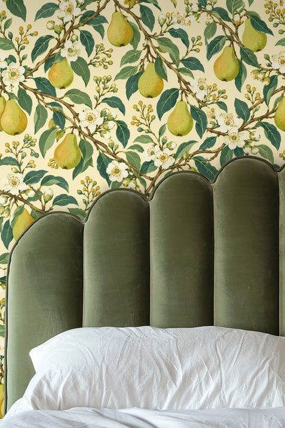 Lifestyle shot of Pearflower Play wallpaper in a cozy nook with natural light filtering.