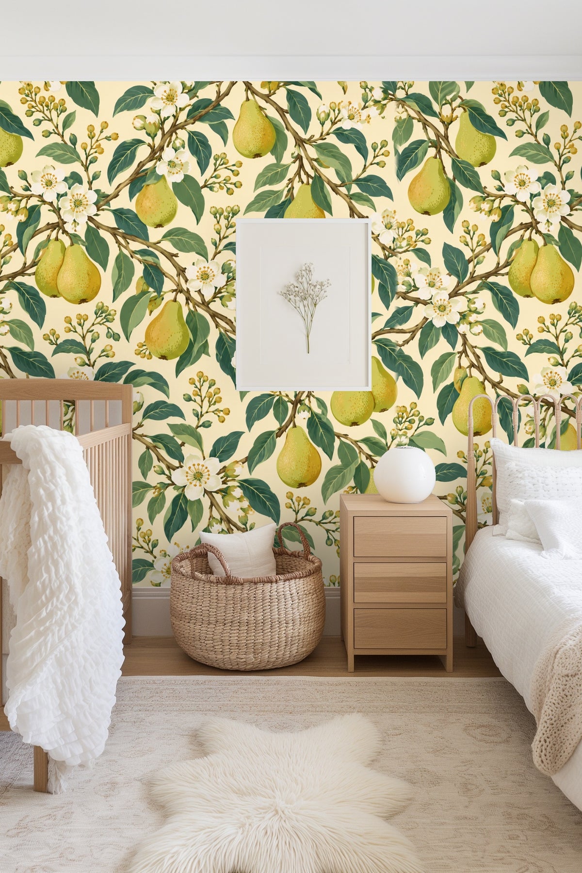 Living room scene showing Pearflower Play wallpaper behind a light wood round coffee table and cream sofa.