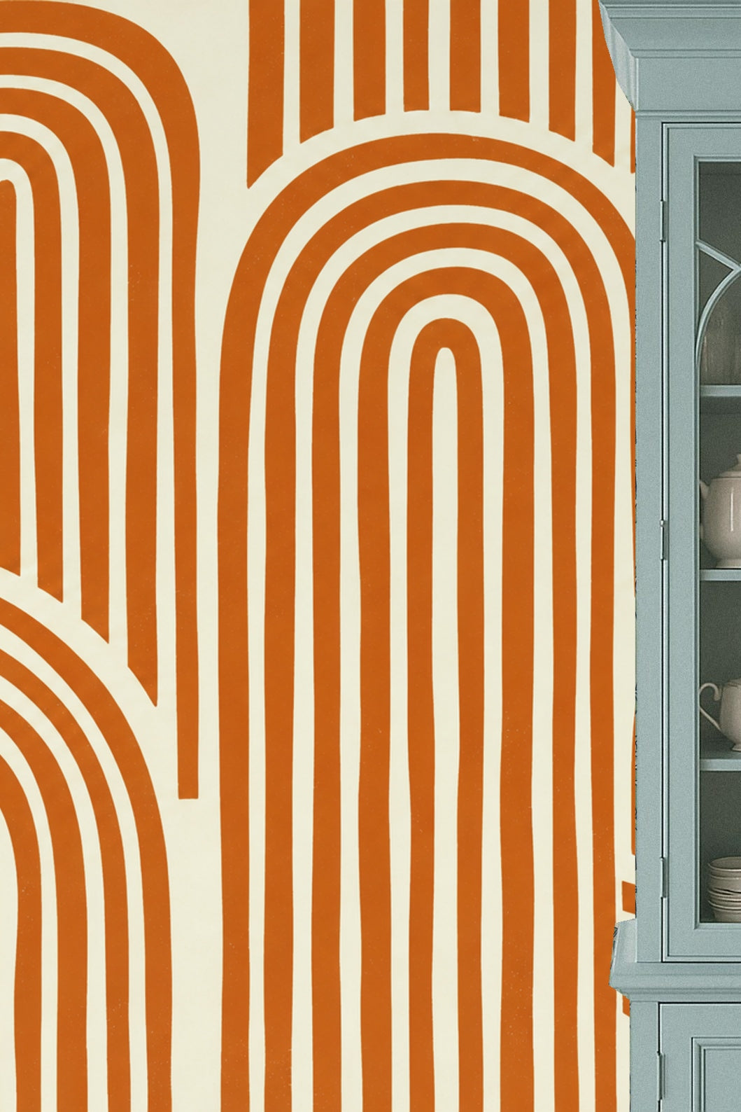 Close-up detail of repeating terracotta arches on cream ground