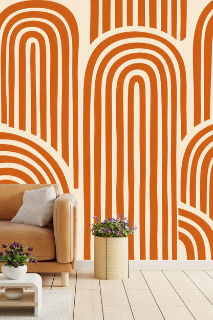 Living room interior featuring terracotta arch wallpaper behind wooden sideboard