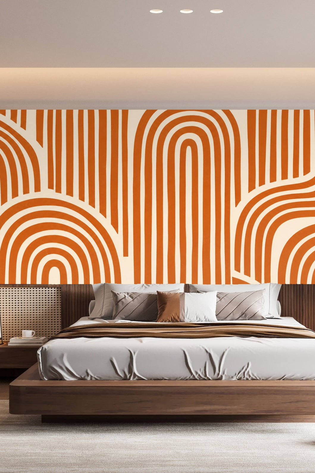 Bedroom with terracotta arch wallpaper behind a wood platform bed