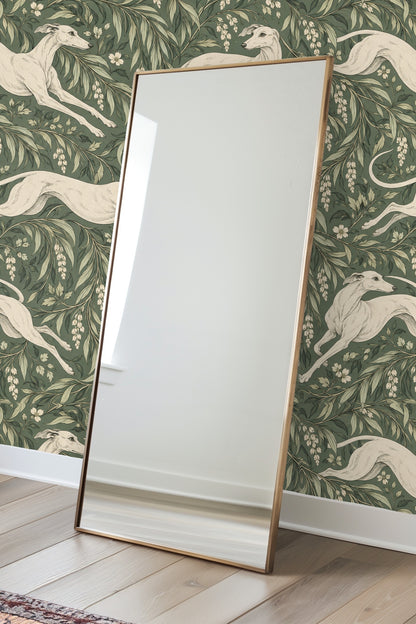 Greyhound standing alert amid botanical leaves, drawn with fine line detail on green background