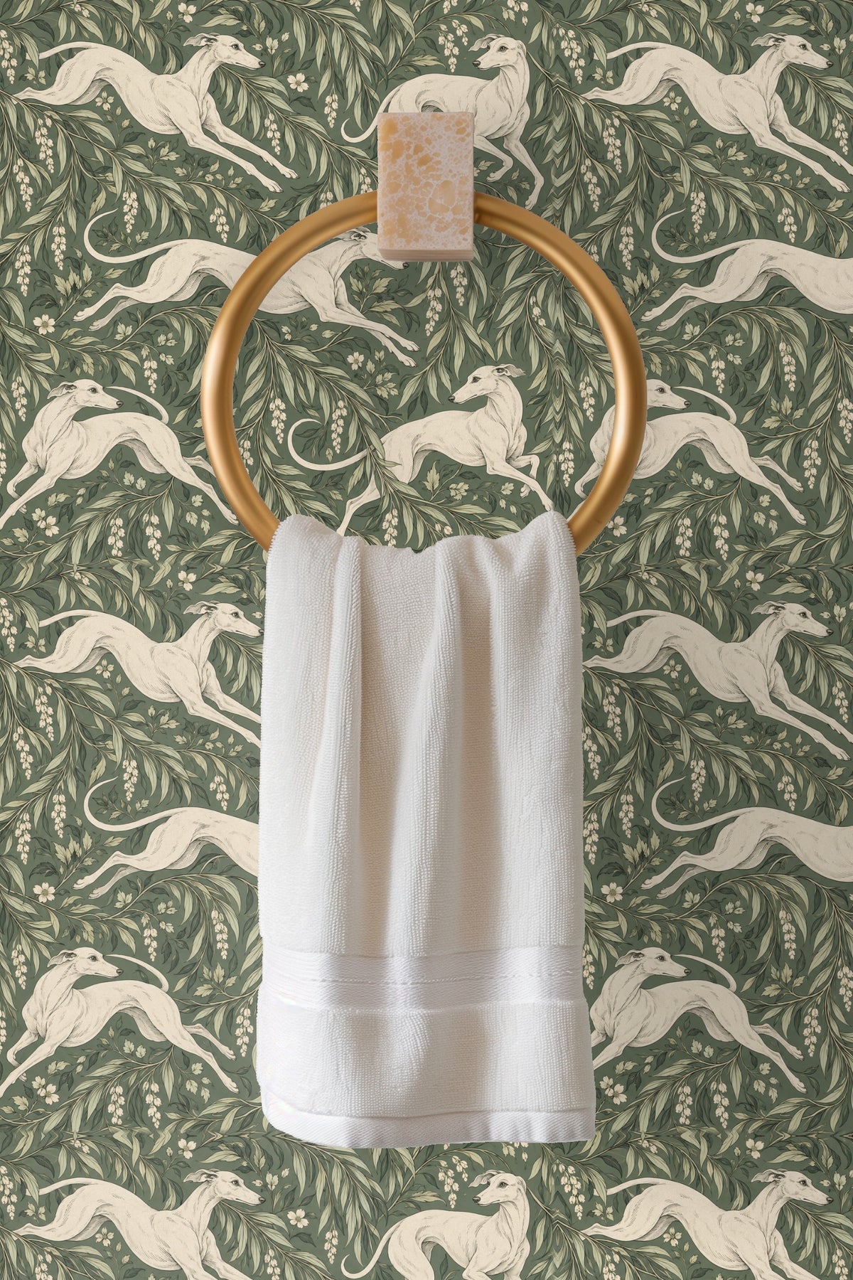 Zoom on white blossoms and leafy branches surrounding a poised greyhound