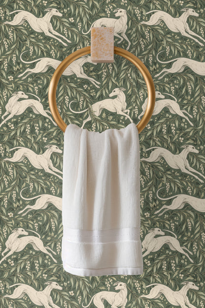 Zoom on white blossoms and leafy branches surrounding a poised greyhound