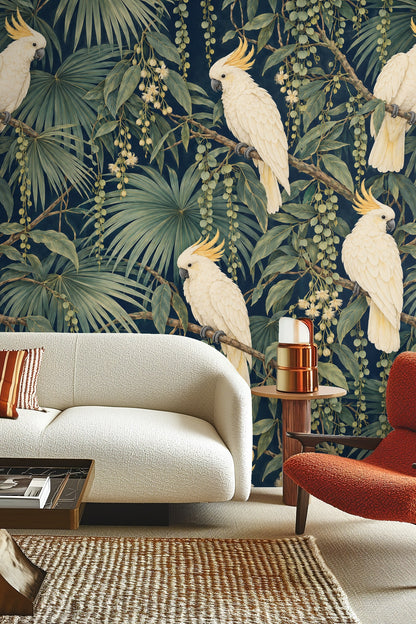 Arrangement of hanging seed pods and elongated green leaves on navy wallpaper