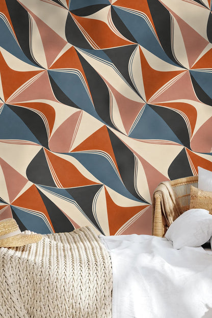 Contrast between warm terracotta and cool blue shapes highlighted.