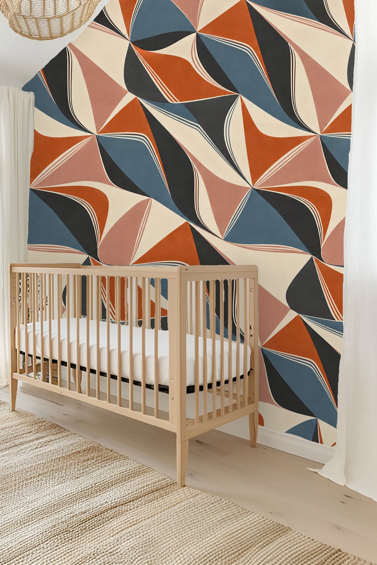 Detail of angular kite-shaped forms in layered colors and fine lines.