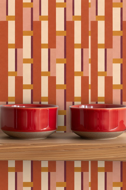 Modern geometric wallpaper wall featuring stacked rectangles in warm terracotta palette