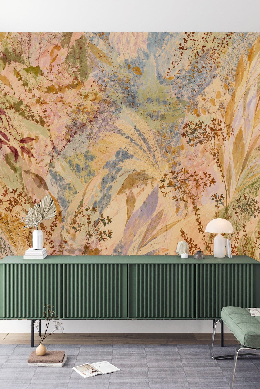 Dusky Meadow Wallpaper mural behind a white sofa and nesting tables, illustrating soft, painterly wildflower motifs