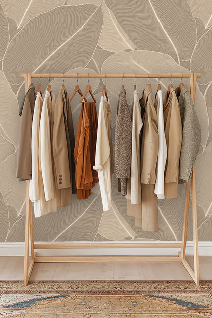 Natural light casting shadows on wallpaper featuring large taupe palm leaves with subtle linear texture
