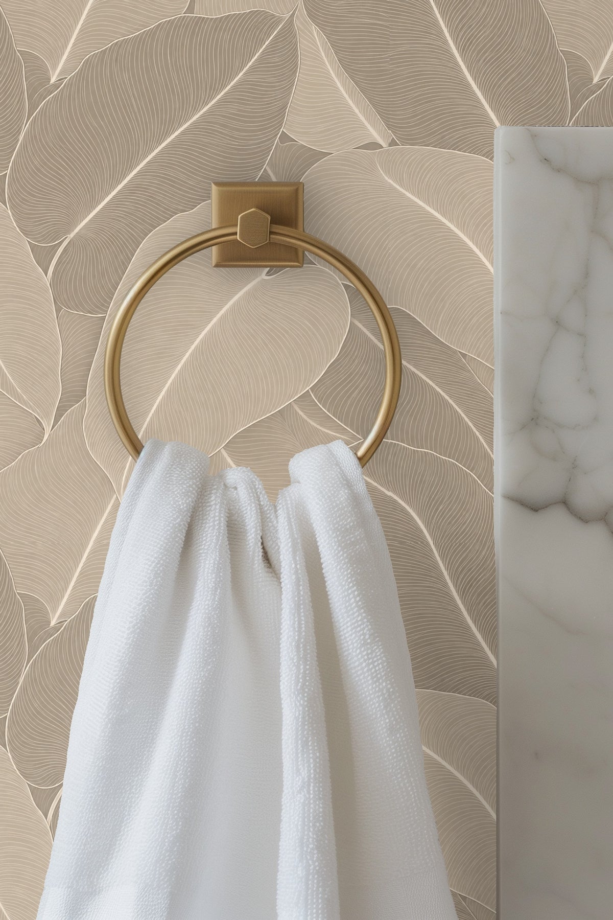 Interior view of entryway highlighting taupe palm leaf wallpaper creating a serene natural look