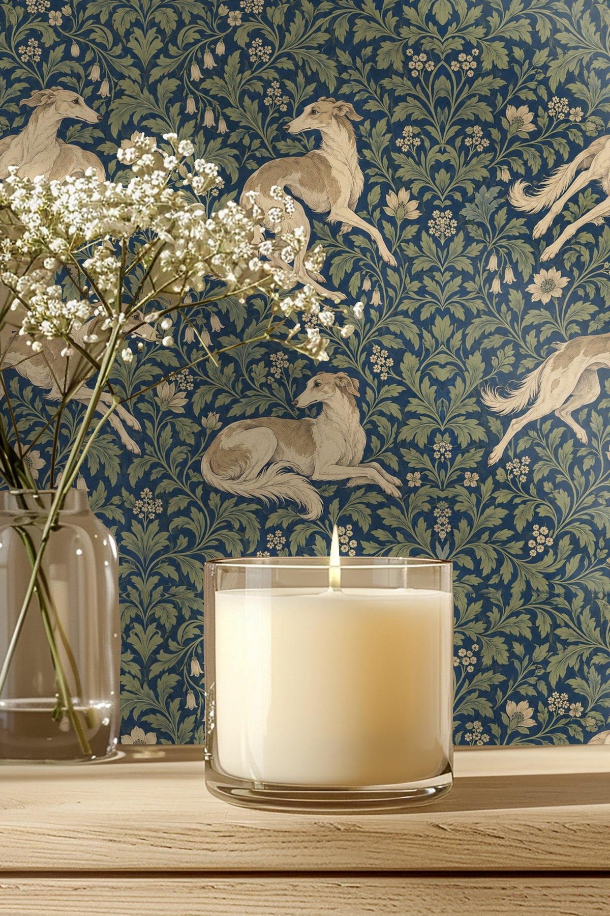 Entryway with hound and floral wallpaper behind beige cabinet and framed art