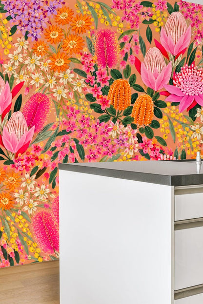 Kids playroom wall decorated with tropical bloom cascade wallpaper featuring pink and orange flowers