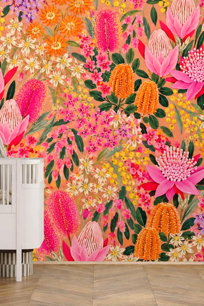 Green leafy stems weaving through fiery floral wallpaper composition
