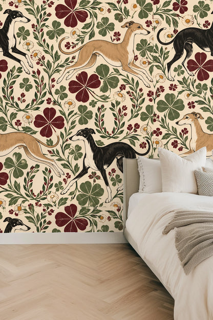 Detailed wallpaper pattern featuring black and fawn greyhounds with burgundy clover and white daisies on an ivory background.