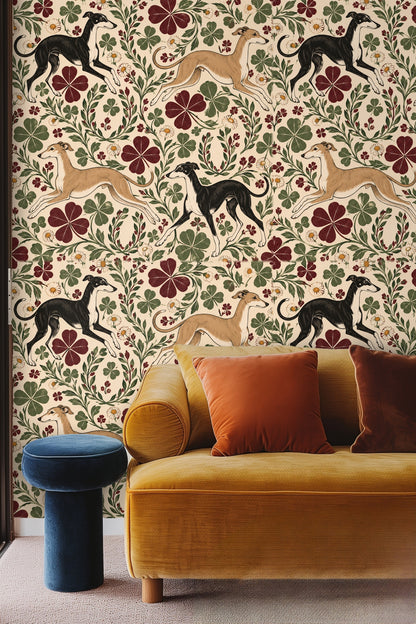 Bedroom wall decorated with wallpaper featuring running beige and black greyhounds alongside clovers and daisies.