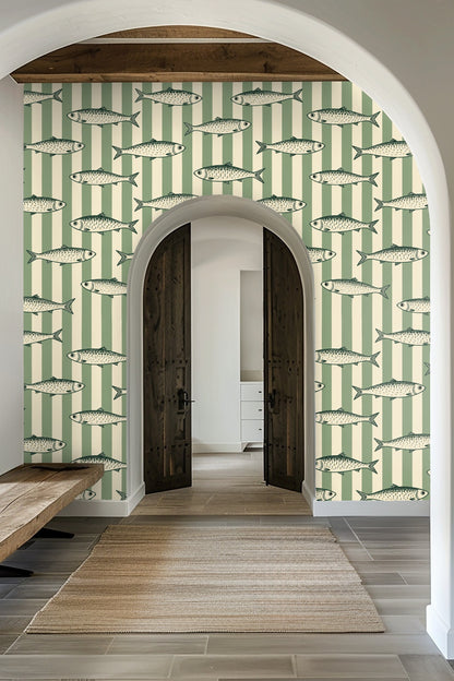 Pattern detail of sardines swimming over mint green and cream vertical stripes wallpaper