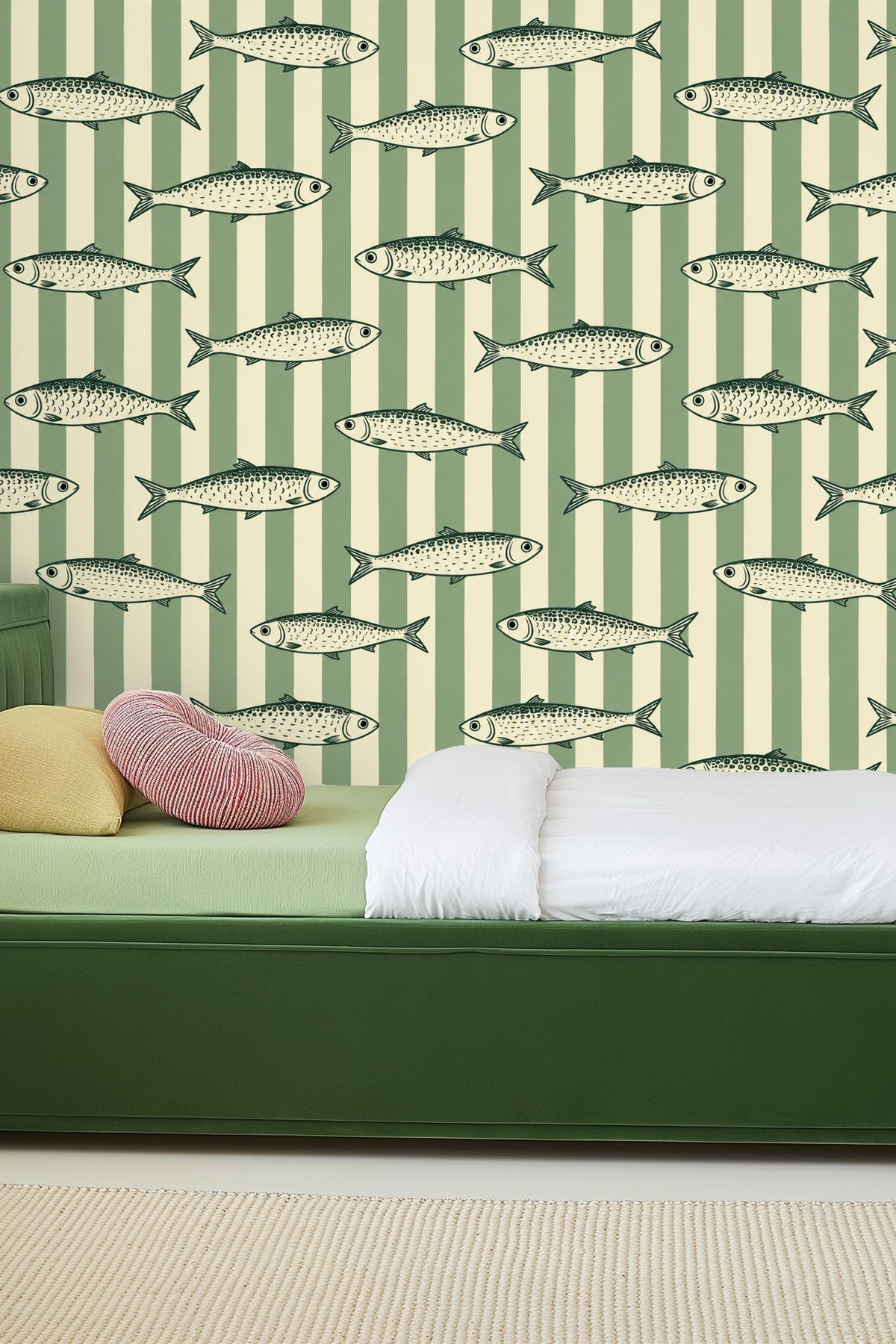 Close-up of side table with candle and vase in front of sardine stripe wallpaper