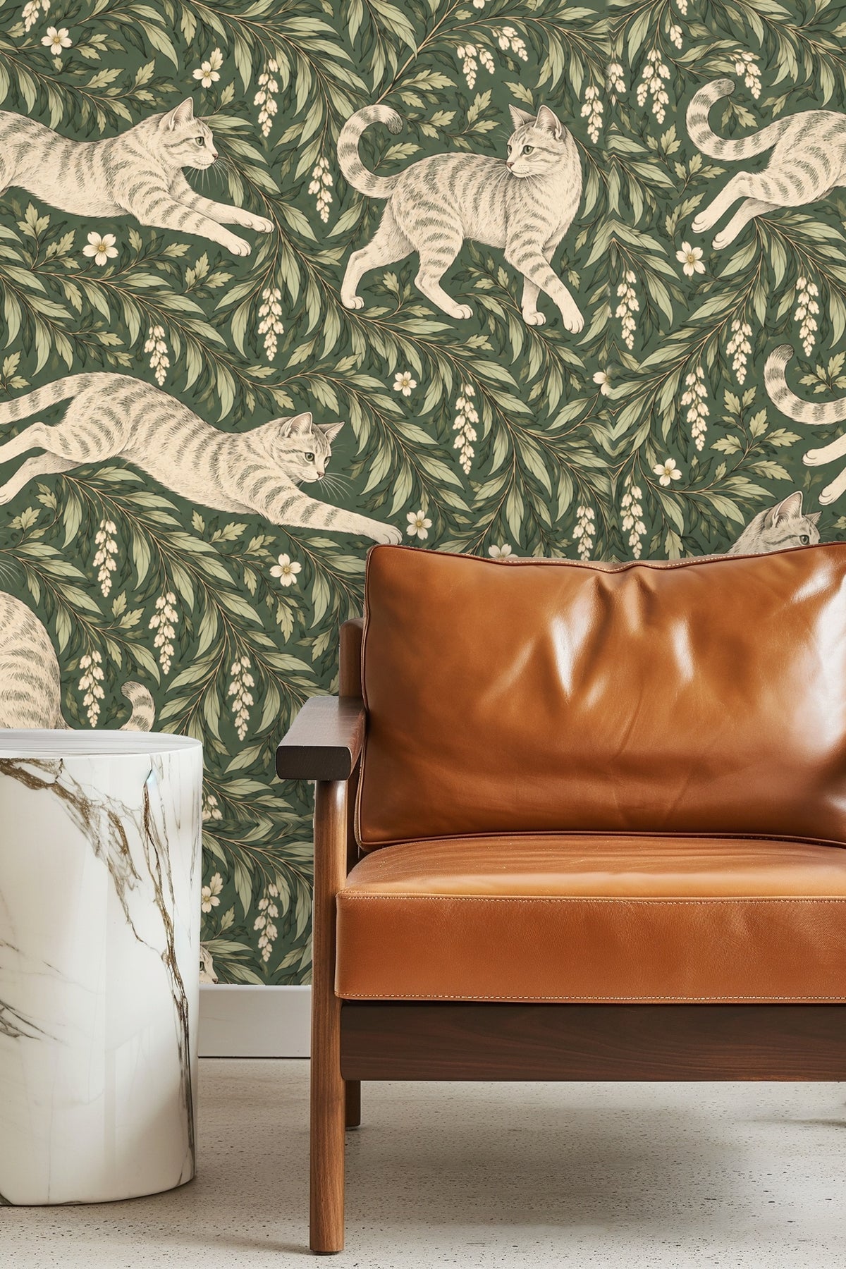 Bedroom with green botanical wallpaper featuring playful tabby cats, wood furniture, and warm textiles.