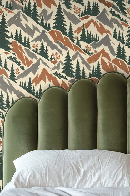 Living room with curved white sofa and midcentury mountain wallpaper