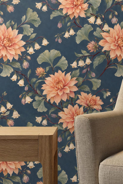 Cozy room corner with dusky dahlia wallpaper, nursery furniture, and armchair.