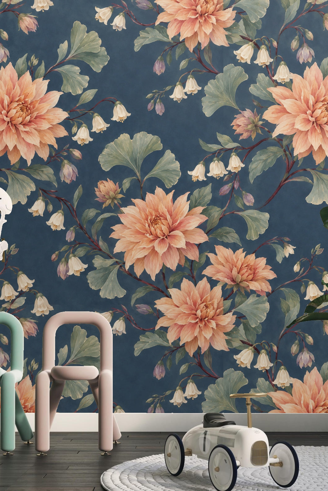 Soft peach dahlia flowers with layered petals on midnight blue wallpaper.