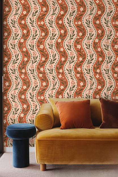 Pattern detail showing terracotta and dusty pink wavy stripes with olive green foliage and white flowers