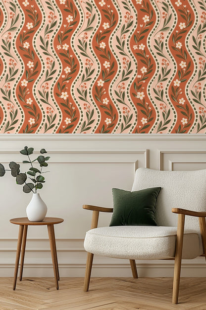 Living room wall with Rustic Blooms Wave wallpaper behind white armchair and wooden side table with plant