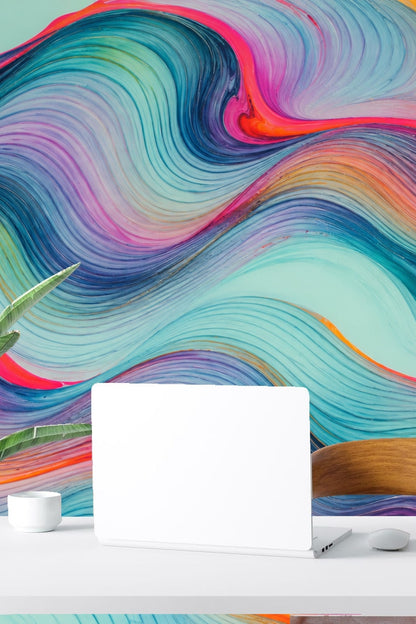 Wide shot of wallpaper wall featuring undulating ribbons of saturated watercolor-like strokes.