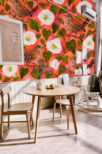 Pattern repeat showing multiple wrens and moonflowers against rich coral-red, with lush green leaves.