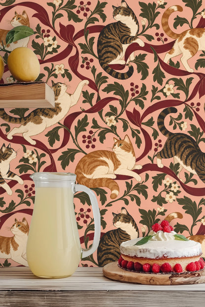 Detailed view of a single tabby cat mid-leap entwined with crimson ribbon, accented by white and burgundy floral elements.