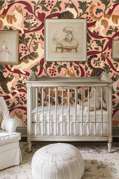 Stretch of wallpaper displaying two tabby cats perched on crimson ribbons surrounded by foliage and clusters of berries.
